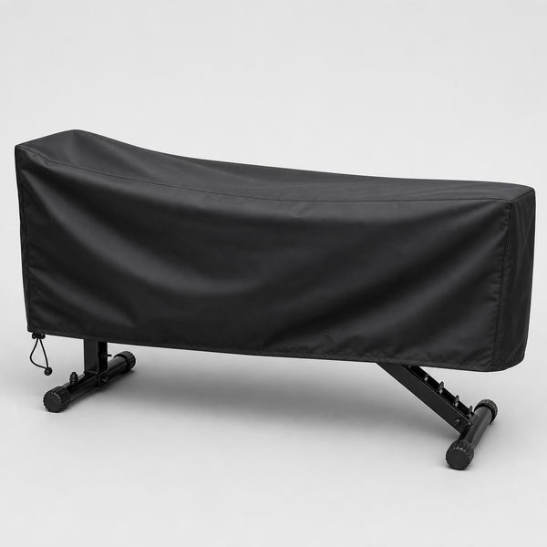 Black PrimeBuild Waterproof Weight Bench Cover fitted over a weight bench, drawcord toggle at the hem
