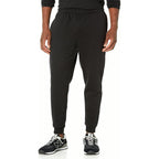 PrimeBuild Men's Performance Fleece Joggers in black on a model, front view of the relaxed tapered fit and ribbed cuffs
