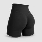 PrimeBuild Women's Sculpt Shorts in black, back view showing the wide high waistband and contoured V-shaped back seam