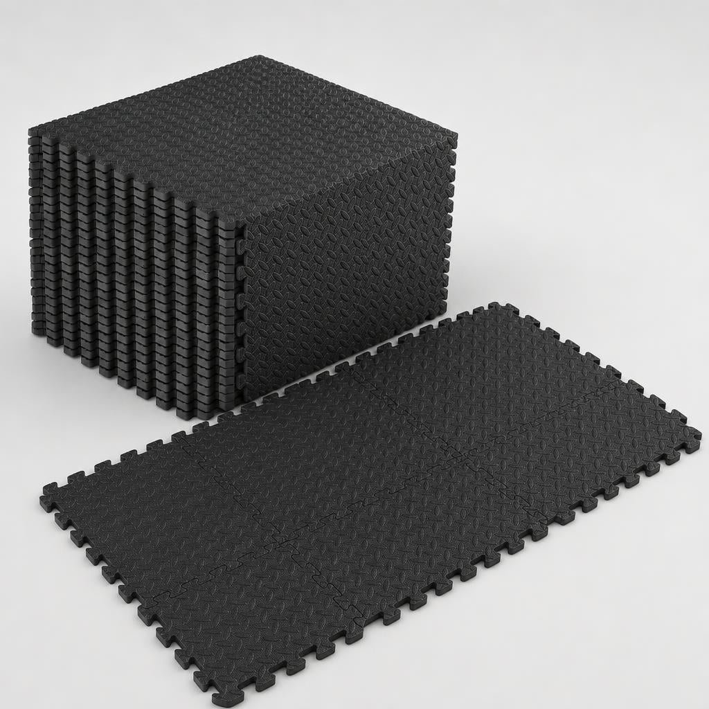 PrimeBuild Interlocking Foam Gym Mat in black, a stack of tiles beside six tiles joined into a flat puzzle floor