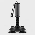 PrimeBuild Arm Wrestling Wrist Trainer in black with textured handle, wrist strap, spring column and 4 suction cups