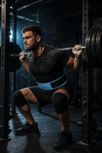 PrimeBuild Self-Locking Weight Lifting Belt in blue worn by a man doing a barbell back squat in a squat rack
