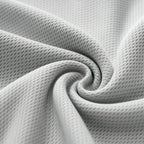 Close-up of the light grey textured knit fabric of the PrimeBuild Men's Quick-Dry Running Tank