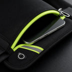 Close-up of the PrimeBuild Bounce-Free Running Belt pouch partly unzipped with a phone inside, key clip and earphone hole