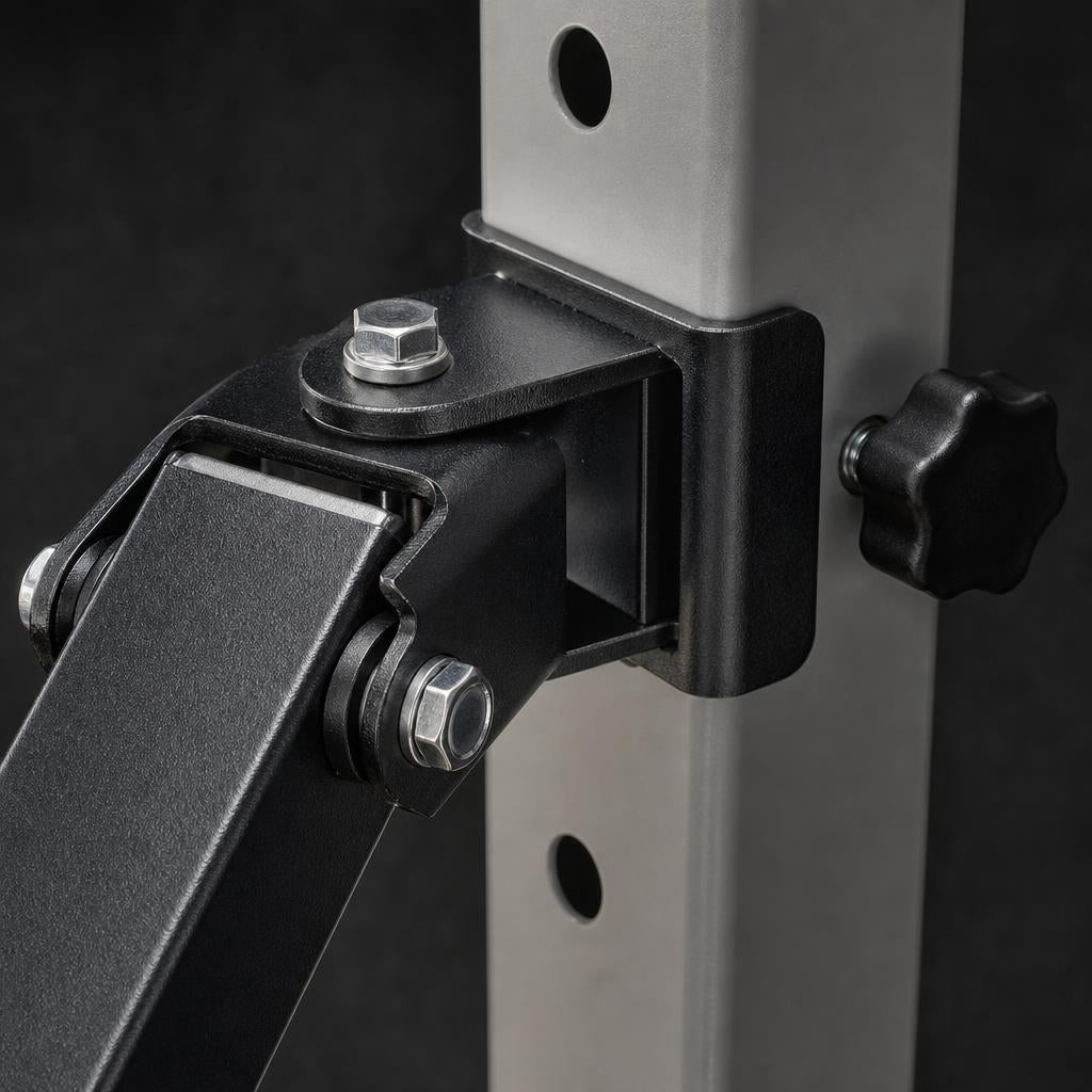 Close-up of the PrimeBuild Landmine Attachment black pivot bracket and locking knob on a power rack upright