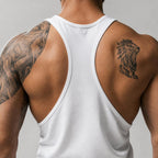 PrimeBuild Men's Bodybuilding Stringer Tank in white, back view showing the Y-shaped racerback and deep armholes