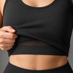 PrimeBuild Women's Tank Sports Bra close-up, outer layer lifted to show the built-in inner bra and underband