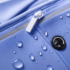 PrimeBuild Slim Running Belt close-up of zipper pull, reflective trim and headphone port with water beading on the fabric