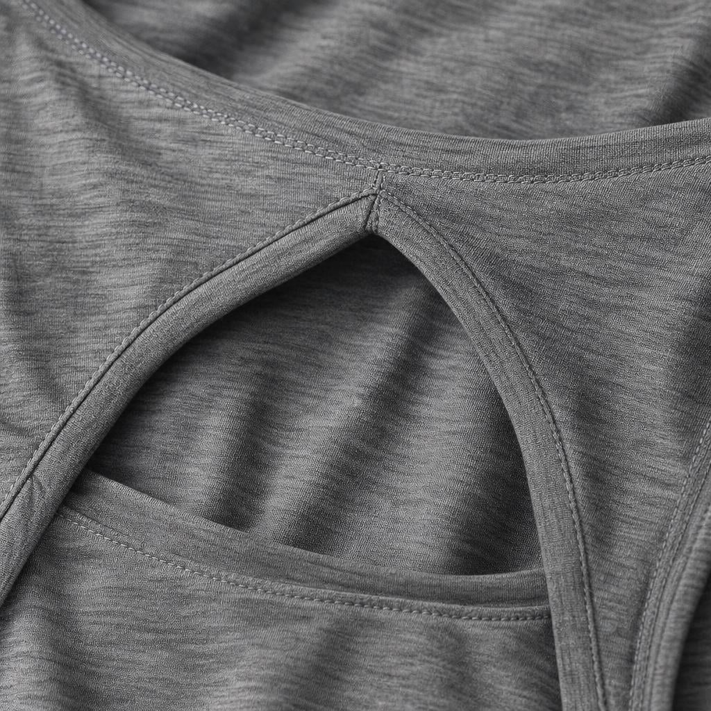 Close-up of the PrimeBuild Open-Back Performance Tank in grey showing the keyhole cut-out, stitched edges and textured knit
