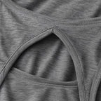 Close-up of the PrimeBuild Open-Back Performance Tank in grey showing the keyhole cut-out, stitched edges and textured knit