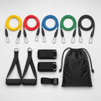 PrimeBuild 11-Piece Resistance Bands Set laid out: colored bands with clips, foam handles, ankle straps, door anchor and bag