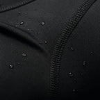 Close-up of the black PrimeBuild Men's Compression Training Tee fabric and stitched seam with water droplets