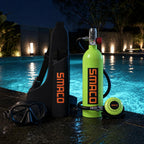Green SMACO S400 mini scuba tank with dive bag and mask at a pool edge at night